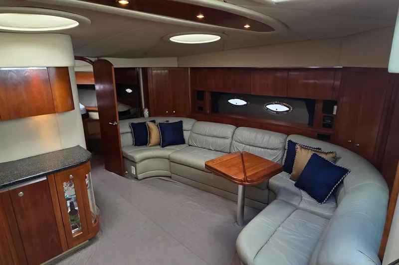 Slide: The Image of 2005 Cruisers Yachts 500 Express interior with open storage compartment and speakers. - 23