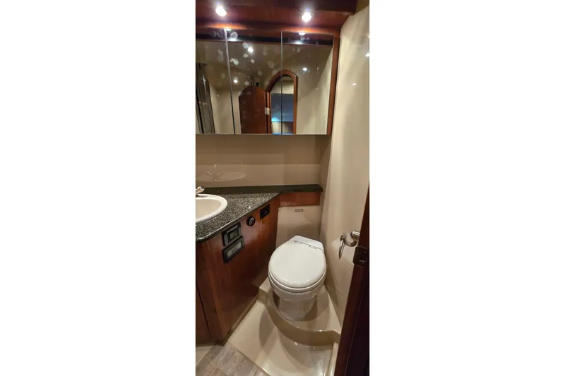 Slide: The Image of 2005 Cruisers Yachts 500 Express kitchen with microwave and granite countertop. - 43