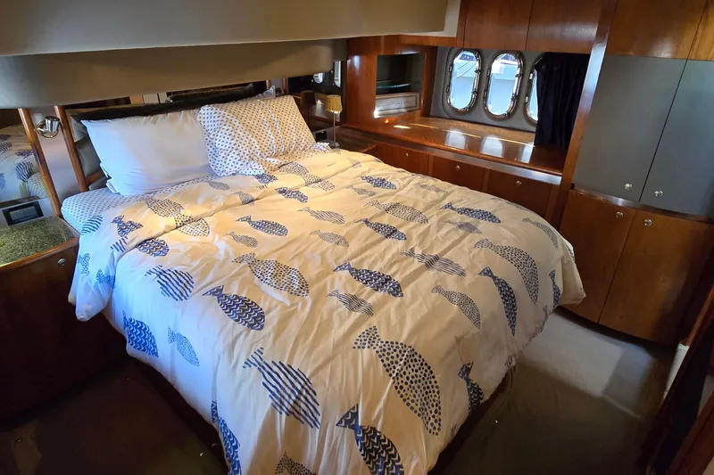 Slide: The Image of 2005 Cruisers Yachts 500 Express interior with open mini fridge and granite countertop. - 45