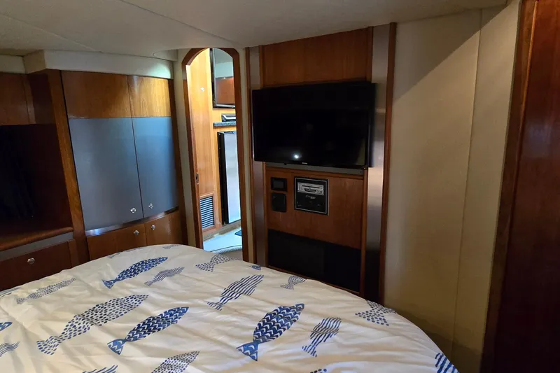 Slide: The Image of Interior of 2005 Cruisers Yachts 500 Express, featuring stairs and cozy cabin entrance. - 46