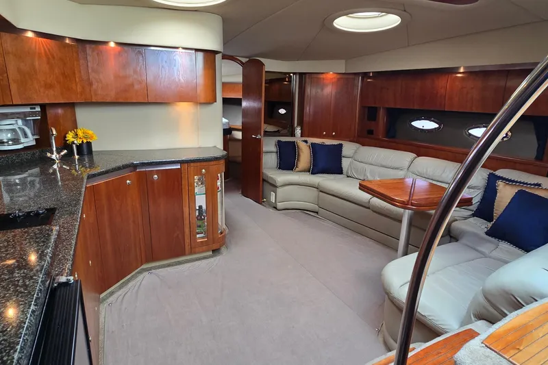 Slide: The Image of Luxurious 2005 Cruisers Yachts 500 Express cabin with cozy bed and modern amenities. - 49