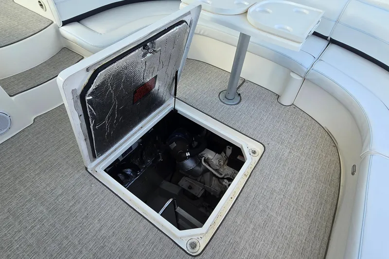 Slide: The Image of Interior of 2005 Cruisers Yachts 500 Express with TV and wooden cabinetry. - 50