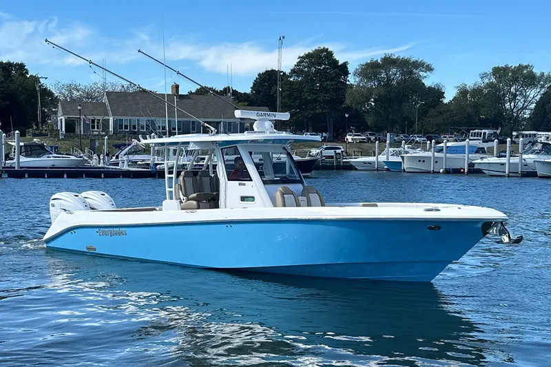 The Image of 2023 Everglades 335 Center Console boat on water near marina. - 0