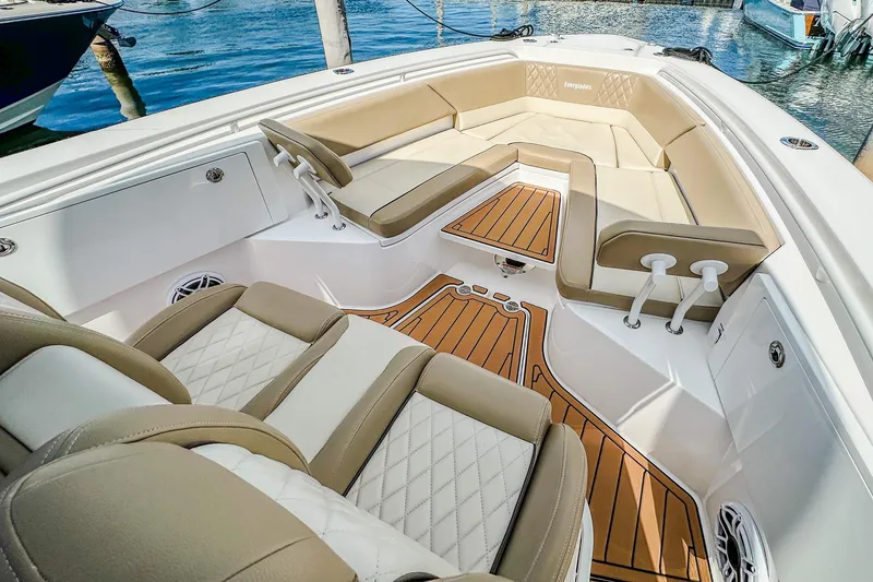 Slide: The Image of 2023 Everglades 335 Center Console boat interior with luxurious seating and teak flooring. - 26