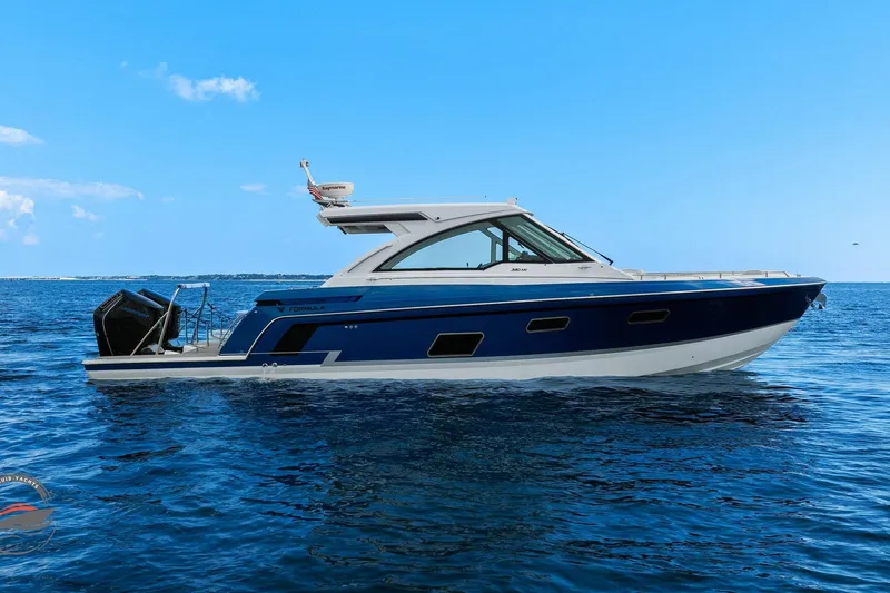 Slide: The Image of 2025 Formula 380 Super Sport Crossover OB boat on open water, side view. - 13