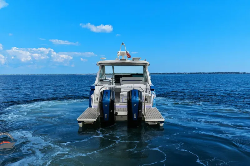 Slide: The Image of 2025 Formula 380 Super Sport Crossover OB on open water, rear view. - 15