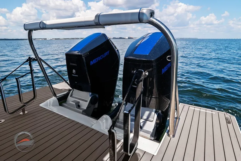 Slide: The Image of 2025 Formula 380 Super Sport Crossover OB with dual Mercury outboard engines on a sunny day. - 19