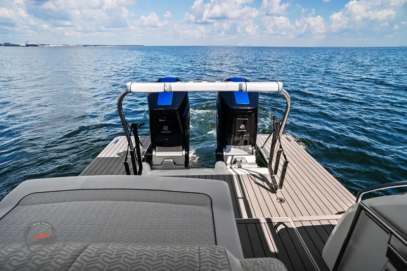 Slide: The Image of 2025 Formula 380 Super Sport Crossover OB on open water, showcasing dual outboard engines. - 20