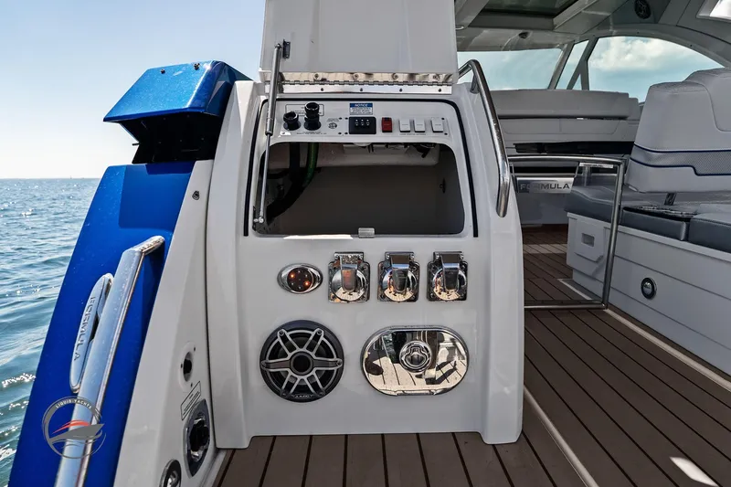 Slide: The Image of 2025 Formula 380 Super Sport Crossover OB boat interior with control panel and seating. - 22