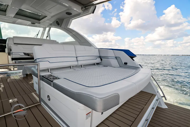 Slide: The Image of 2025 Formula 380 Super Sport Crossover OB luxury boat interior with spacious seating and ocean view. - 23