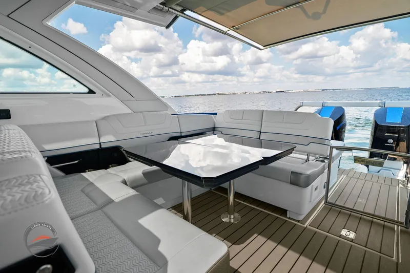 Slide: The Image of 2025 Formula 380 Super Sport Crossover OB yacht interior with luxurious seating and ocean view. - 27