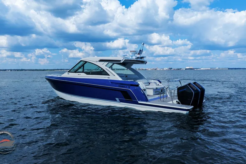 Slide: The Image of 2025 Formula 380 Super Sport Crossover OB on open water under a cloudy sky. - 3