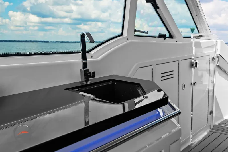 Slide: The Image of 2025 Formula 380 Super Sport Crossover OB yacht interior with sleek sink and ocean view. - 30