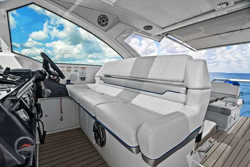 Slide: The Image of 2025 Formula 380 Super Sport Crossover OB interior with luxurious seating and ocean view. - 34