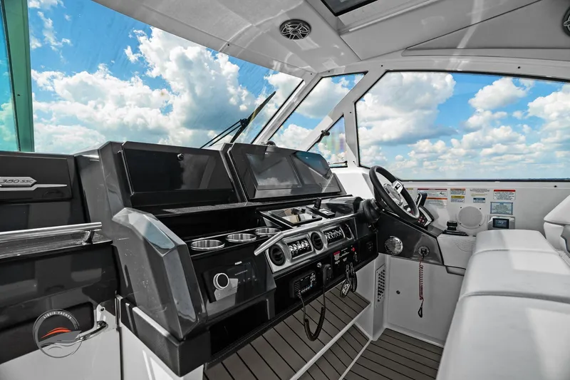 Slide: The Image of 2025 Formula 380 Super Sport Crossover OB cockpit with modern controls and panoramic view. - 35