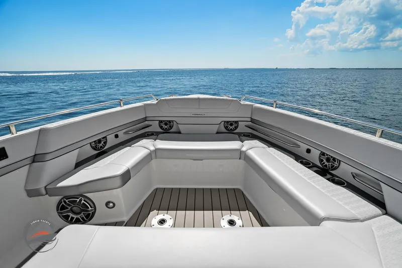 Slide: The Image of 2025 Formula 380 Super Sport Crossover OB boat interior with luxurious seating and ocean view. - 40