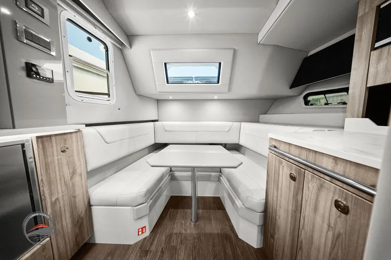 Slide: The Image of 2025 Formula 380 Super Sport Crossover OB interior with modern seating and wood accents. - 43