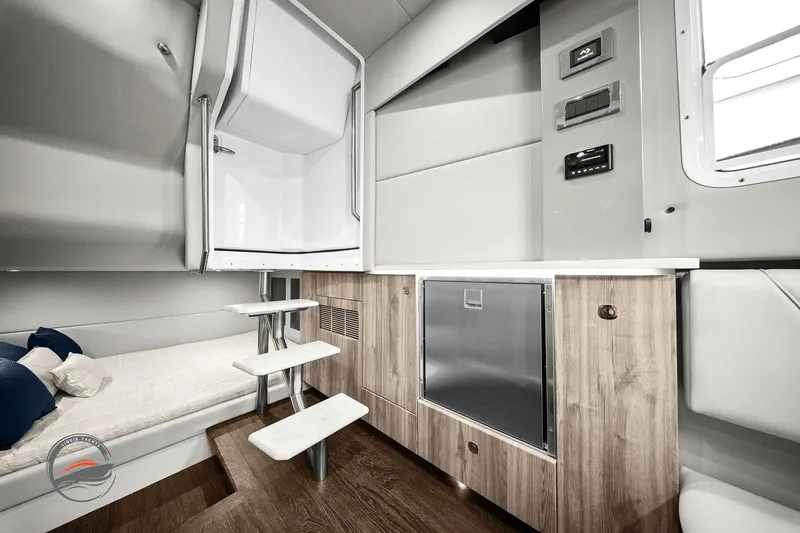 Slide: The Image of 2025 Formula 380 Super Sport Crossover OB interior with modern design and wooden cabinetry. - 45