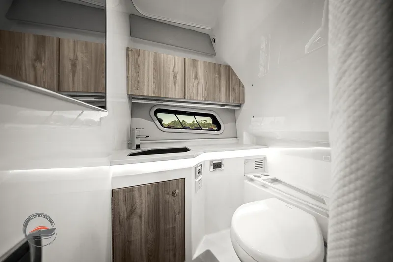 Slide: The Image of 2025 Formula 380 Super Sport Crossover OB bathroom with modern design and wood accents. - 49