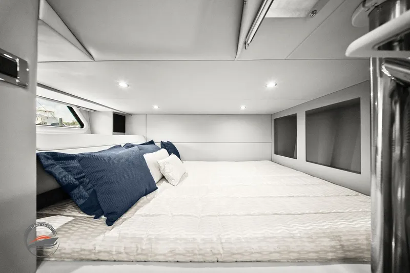 Slide: The Image of 2025 Formula 380 Super Sport Crossover OB cabin interior with bed and pillows. - 53