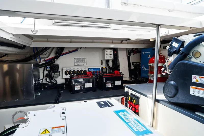 Slide: The Image of Engine room of 2025 Formula 380 Super Sport Crossover OB with batteries and safety equipment. - 57