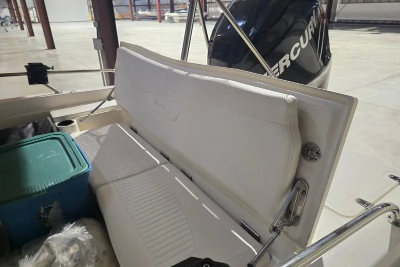 Slide: The Image of 2008 Boston Whaler 180 Dauntless boat interior with seating and Mercury engine. - 11