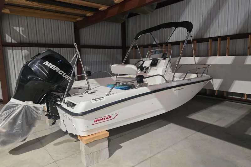The Image of 2008 Boston Whaler 180 Dauntless boat with Mercury engine in storage. - 3