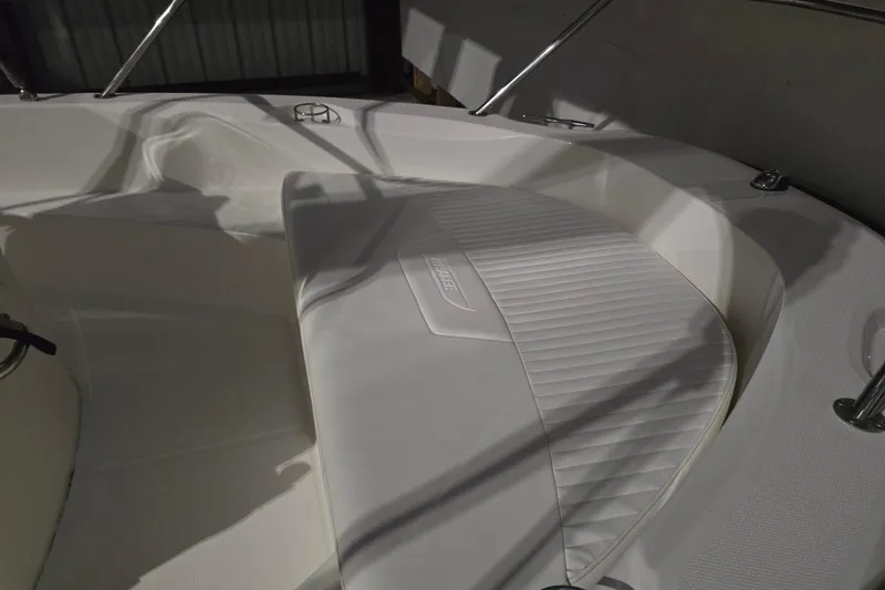 Slide: The Image of 2008 Boston Whaler 180 Dauntless boat interior with cushioned seating and sleek design. - 5