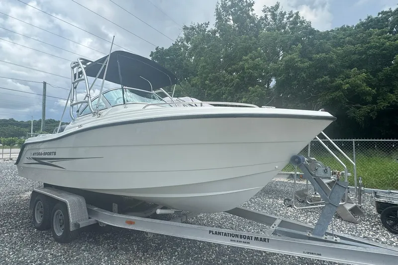 The Image of 2004 Hydra-Sports Lightning 202 DC boat on trailer, parked outdoors. - 0