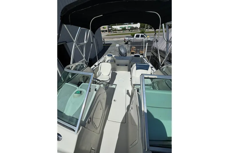 Slide: The Image of 2004 Hydra-Sports Lightning 202 DC boat interior with seating and canopy. - 10