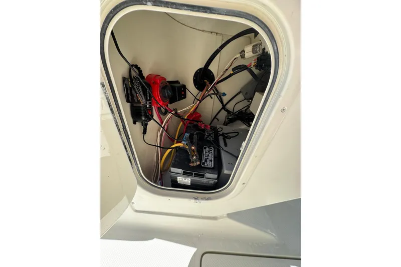 Slide: The Image of 2004 Hydra-Sports Lightning 202 DC boat battery compartment with wiring and electrical components. - 12