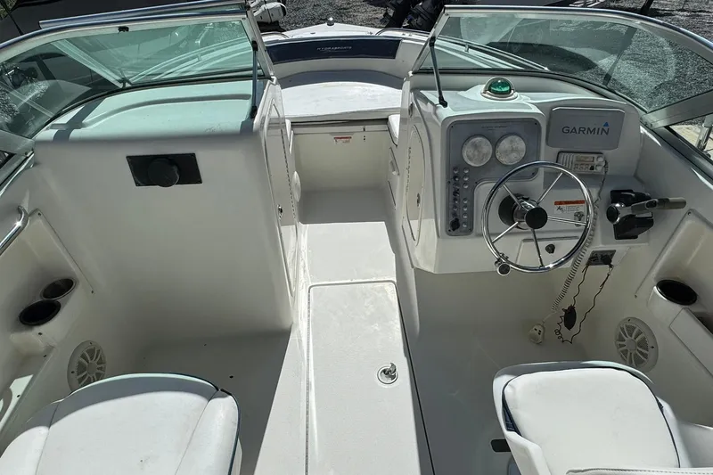 Slide: The Image of 2004 Hydra-Sports Lightning 202 DC boat interior with Garmin navigation system and steering wheel. - 4