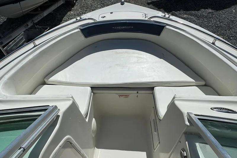 Slide: The Image of 2004 Hydra-Sports Lightning 202 DC boat interior with cushioned seating and storage. - 9