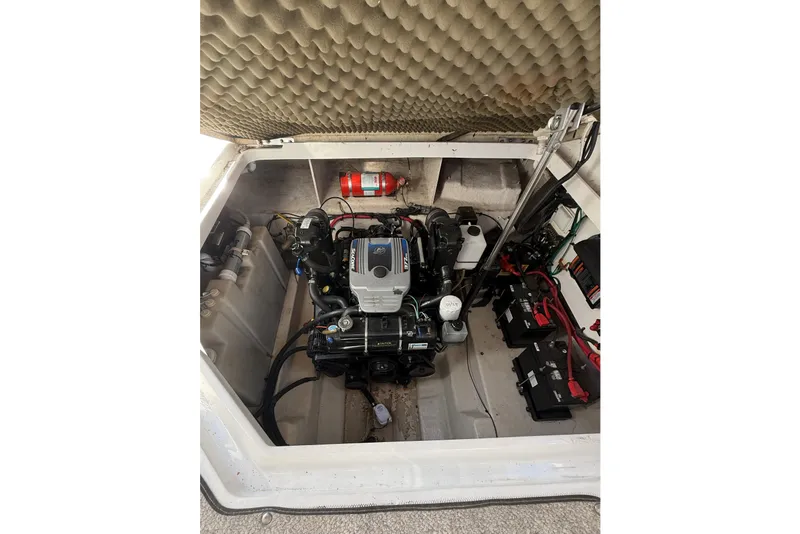Slide: The Image of Engine compartment of a 2009 Sea Ray 270 Sundancer with visible components and fire extinguisher. - 26