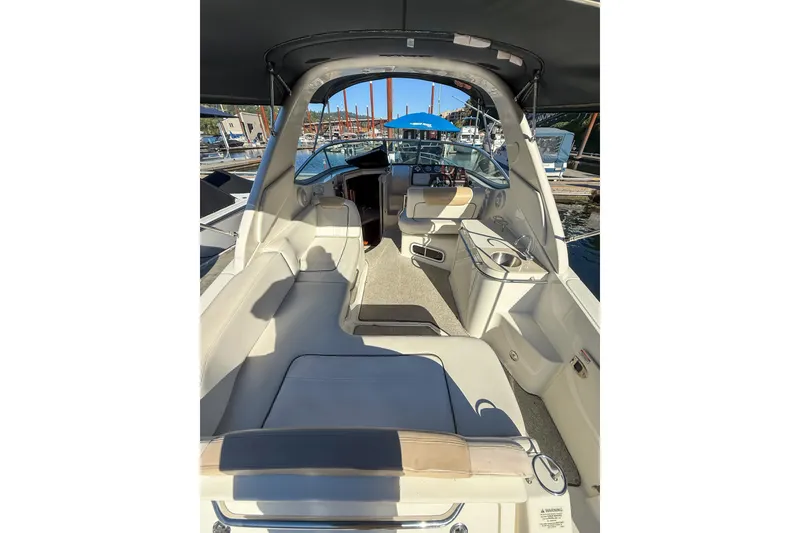 Slide: The Image of Interior view of 2009 Sea Ray 270 Sundancer boat with seating and helm. - 4