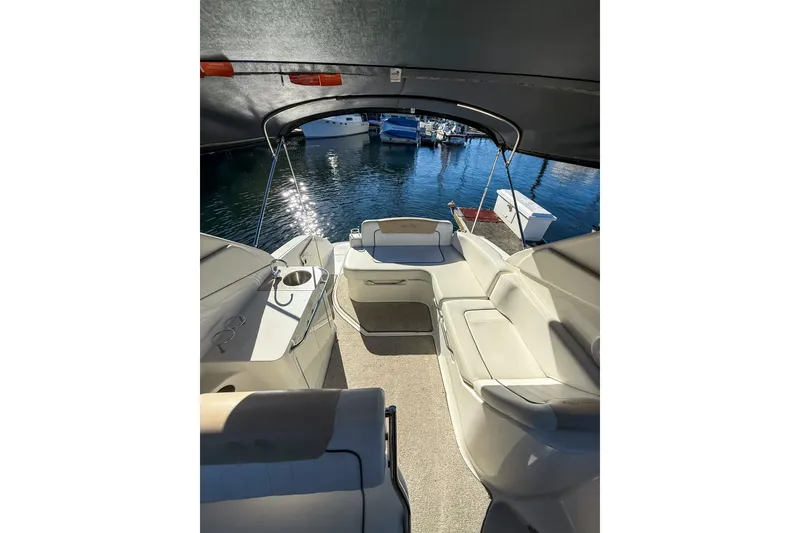 Slide: The Image of 2009 Sea Ray 270 Sundancer boat interior with seating and water view. - 8