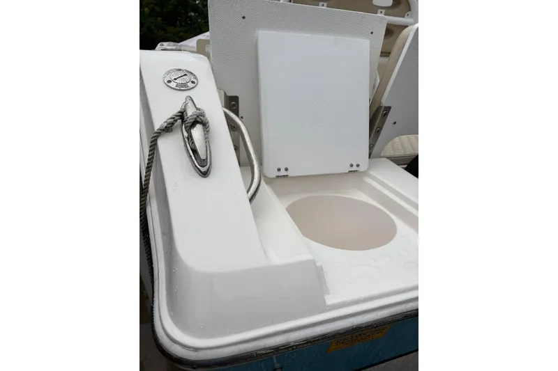 Slide: The Image of 2019 Release 210 RX boat with rope cleat and storage compartment. - 18