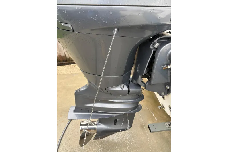 Slide: The Image of Close-up of a 2019 Release 210 RX boat motor with water streaming down. - 20