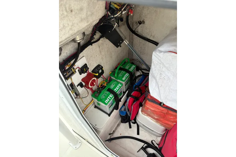 Slide: The Image of Interior of 2019 Release 210 RX boat showing battery compartment and storage area. - 22
