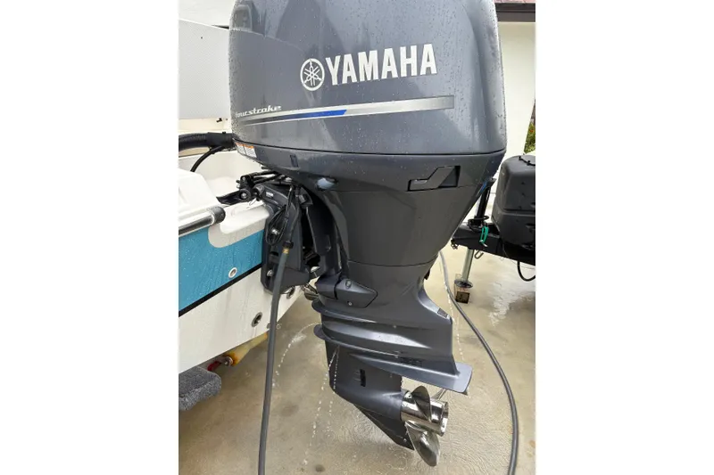 Slide: The Image of Yamaha outboard motor on 2019 Release 210 RX boat, wet surface. - 5