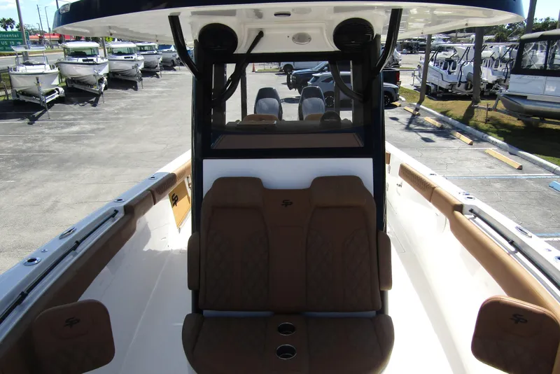 Slide: The Image of 2025 Sea Pro 322 Offshore boat interior with brown seating and modern design. - 13