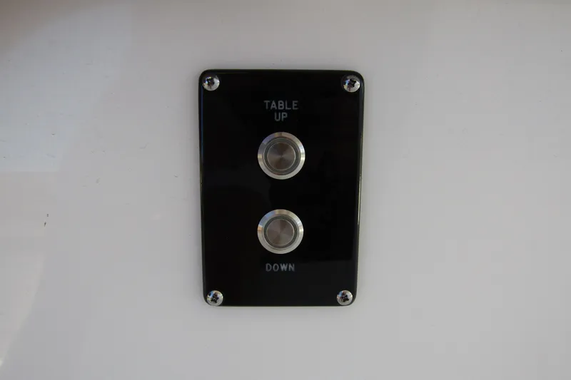 Slide: The Image of Control panel with "Table Up" and "Down" buttons on 2025 Sea Pro 322 Offshore. - 17