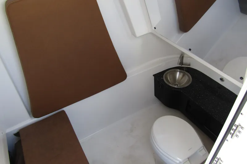 Slide: The Image of Interior of 2025 Sea Pro 322 Offshore boat bathroom with sink and toilet. - 19