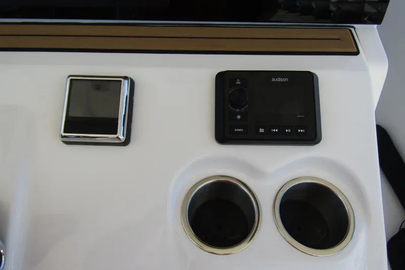 Slide: The Image of Control panel and cup holders on 2025 Sea Pro 322 Offshore boat. - 28