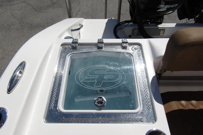 Slide: The Image of Livewell on 2025 Sea Pro 322 Offshore boat, featuring clear lid and logo. - 37