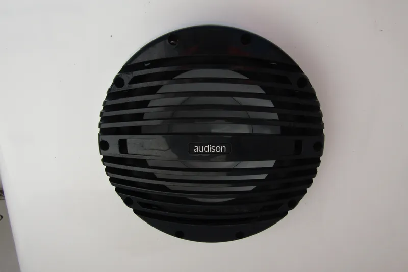 Slide: The Image of Audison speaker on Sea Pro 322 Offshore boat, 2025 model, black grille design. - 43