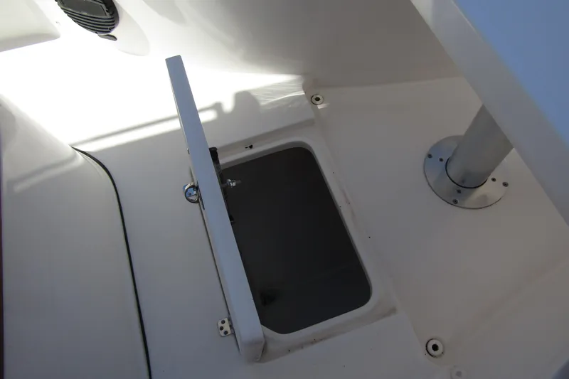 Slide: The Image of Open storage compartment on 2025 Sea Pro 322 Offshore boat deck. - 16