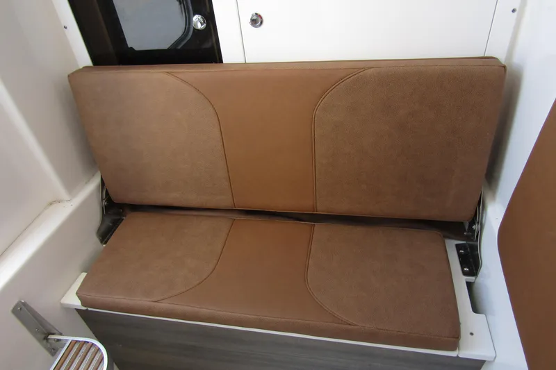 Slide: The Image of Brown cushioned seat on 2025 Sea Pro 322 Offshore boat interior. - 21