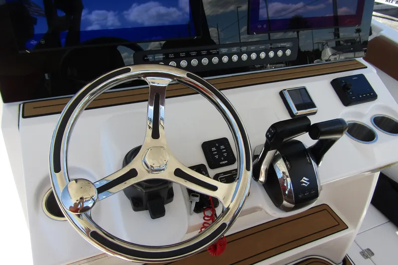 Slide: The Image of Helm of 2025 Sea Pro 322 Offshore boat with modern controls and steering wheel. - 27