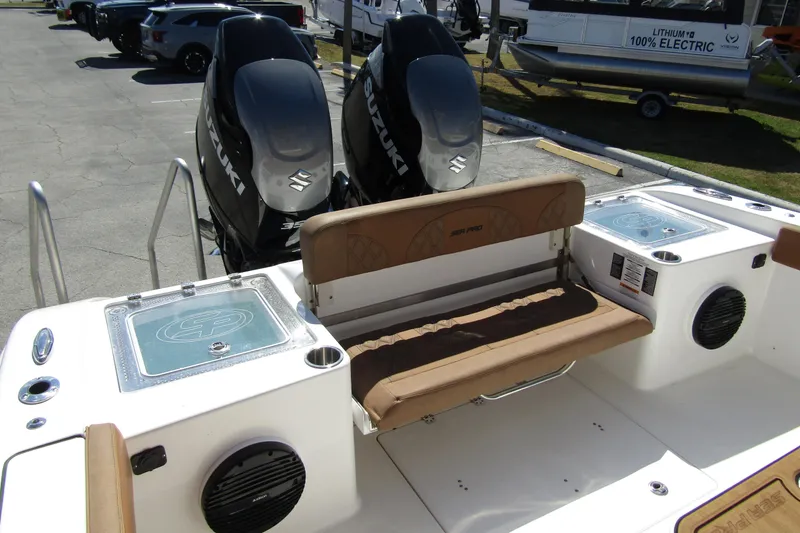 Slide: The Image of 2025 Sea Pro 322 Offshore boat with dual Suzuki outboard engines and comfortable seating. - 36